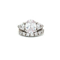Oval Cut Ring with Trillion Side Stones and Seven Stone Curved Band