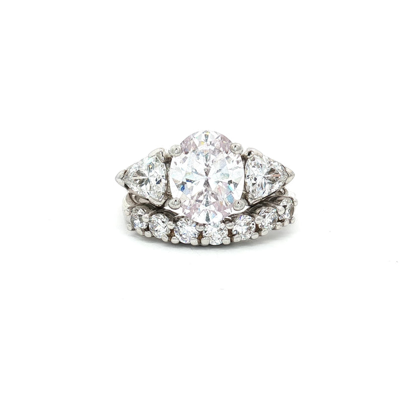 Oval Cut Ring with Trillion Side Stones and Seven Stone Curved Band
