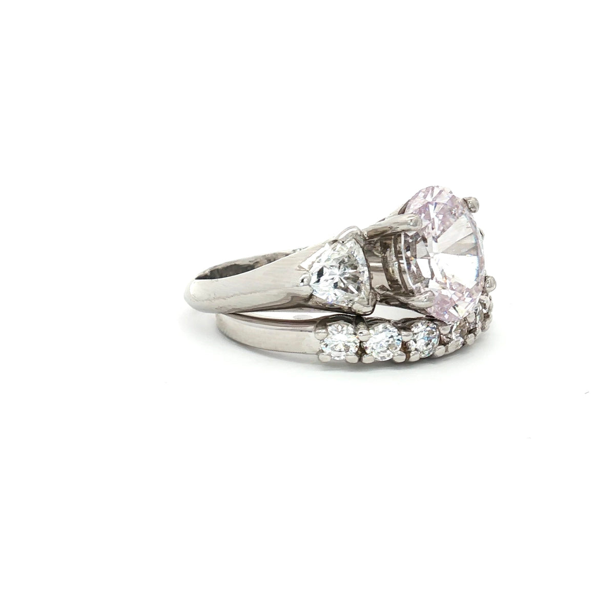 Oval Cut Ring with Trillion Side Stones and Seven Stone Curved Band