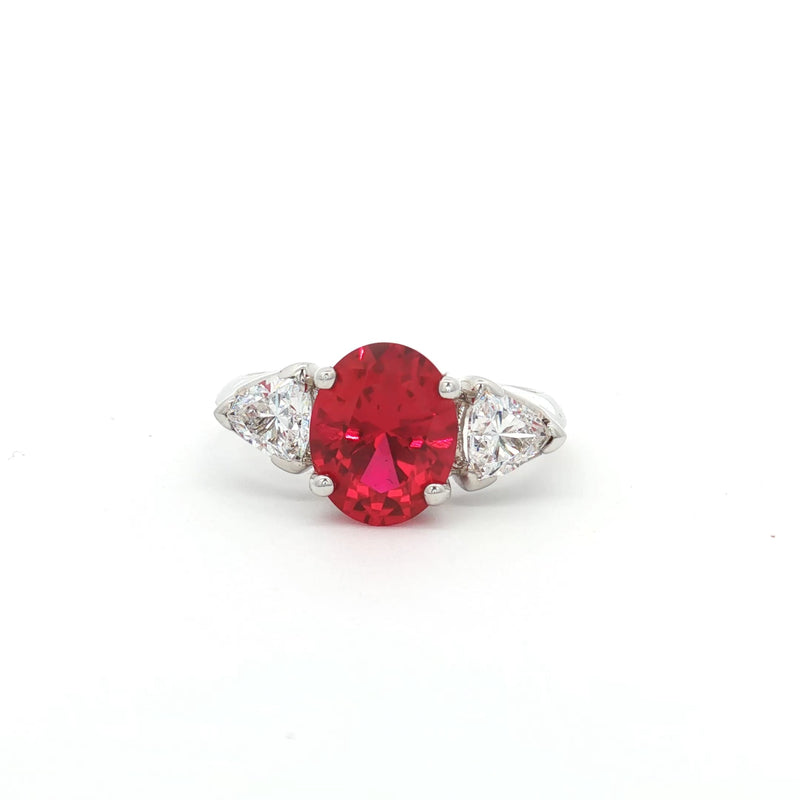 Oval Cut Ring with Trillion Side Stones and Ruby Centre Stone