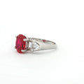 Oval Cut Ring with Trillion Side Stones and Ruby Centre Stone