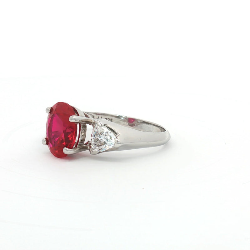 Oval Cut Ring with Trillion Side Stones and Ruby Centre Stone