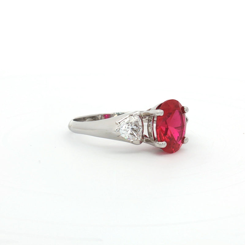 Oval Cut Ring with Trillion Side Stones and Ruby Centre Stone