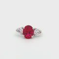 Oval Cut Ring with Trillion Side Stones and Ruby Centre Stone