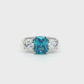 Radiant Cut Ring with Two Brilliant Side Stones and Topaz Centre Stone