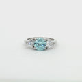 Three Stone Ring with Aqua Marine Brilliant Centre Stone and Trillion Side Stones