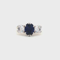Oval Cut Ring with Two Brilliant Side Stones with Sapphire Centre Stone