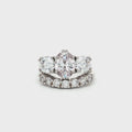 Oval Cut Ring with Two Brilliant Side Stones and Seven Stone Curved Band