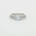 Petite Brilliant Cut Solitaire Ring with Princess Cut Channel Setting
