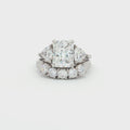 Radiant Cut Ring with Two Trillion Side Stones and Five Stone Curved Band