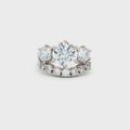 Large Three Stone Brilliant Cut Ring and Seven Stone Curved Band