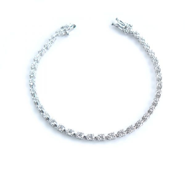 Tennis bracelet with diamond simulants of 1 carat size in silver with white gold plating or solid white gold