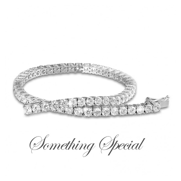 gorgeous diamond tennis bracelet with the tag "something special"