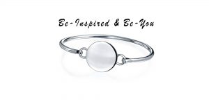 be in inspired be you promotional banner for new line of product for desert diamonds featuring a silver disc engravable bracelet