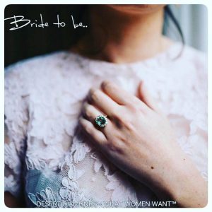 Bride to be promotional image of woman wearing a large blue gem ring wiht her hand elegantly placed across her chest