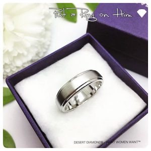 brushed silver men's wedding band set on a white cushioned desert diamonds gift box