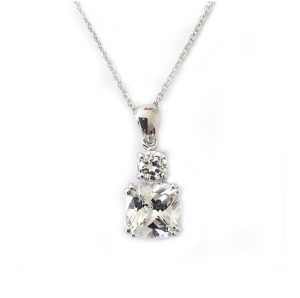 Meghan Markle inspired diamond simulant drop pendant featuring a large cushion cut diamond simulant stone with a smaller brilliant cut stone, both double 4 prong set in sterling silver with white gold plating
